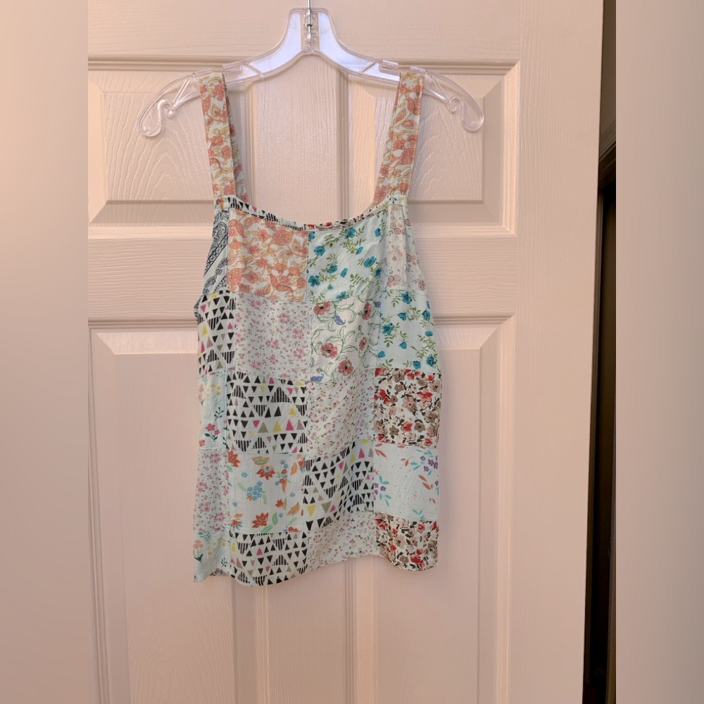 Blue sky patchwork tank top
Size small
Light aqua